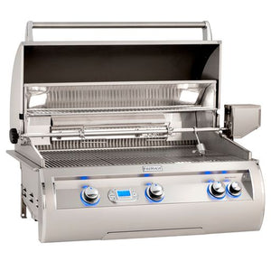 Fire Magic Echelon built-in grill hood open displaying top cooking shelf, halogen lights, rotisserie kit and blue-lit LED lights. Available on unitedgrills.com