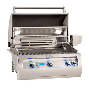 Fire Magic Echelon built-in grill with hood open displaying top cooking rack, halogen lights, blue-lit LED light knobs and rotisserie kit. Available on unitedgrills.com